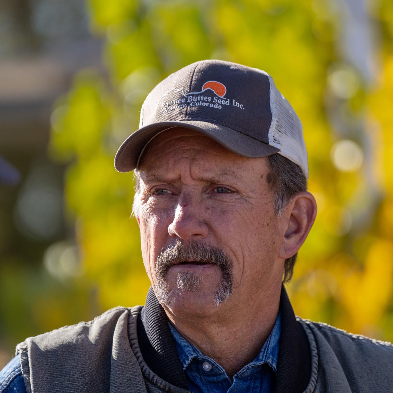 male district supervisor wearing ballcap