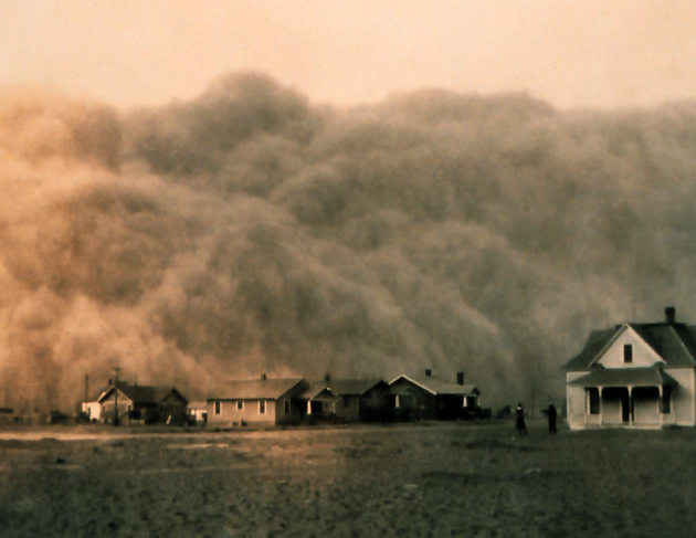 houses in a cloud of dust